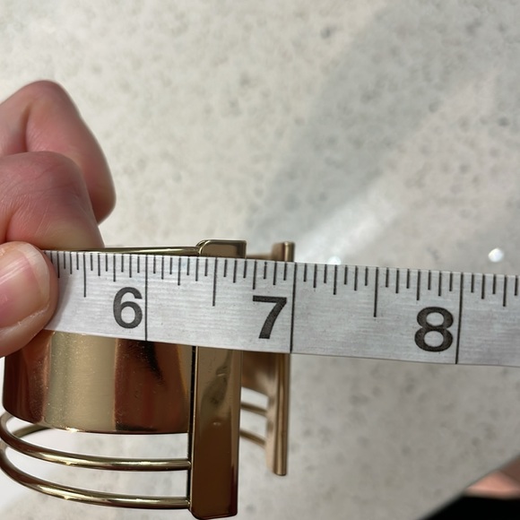 Stylish Shiny Aldo Gold Slip On Bangle Bracelet With Cut Outs - Picture 7 of 7